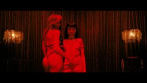 Jennifer Lopez and Constance Wu in hot Hustler striptease video